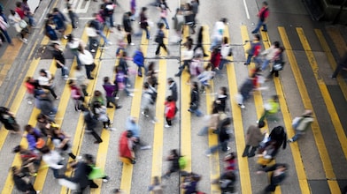 People crossing a busy street in Hong Kong