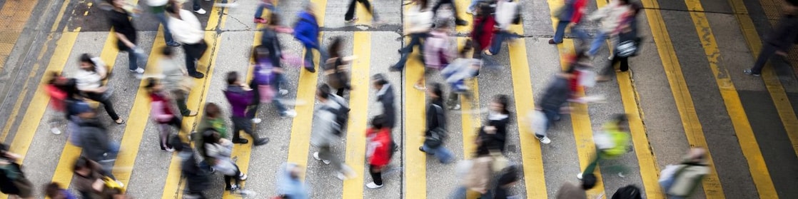People crossing a busy street in Hong Kong