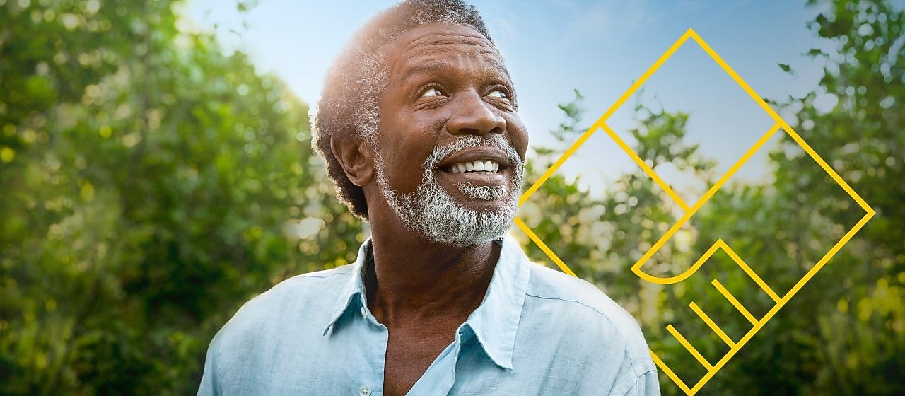 Smiling man with a beard in front of trees with an outline of the Generating shareholder value graph