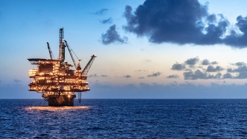 Offshore oil platform in the see lit up at night